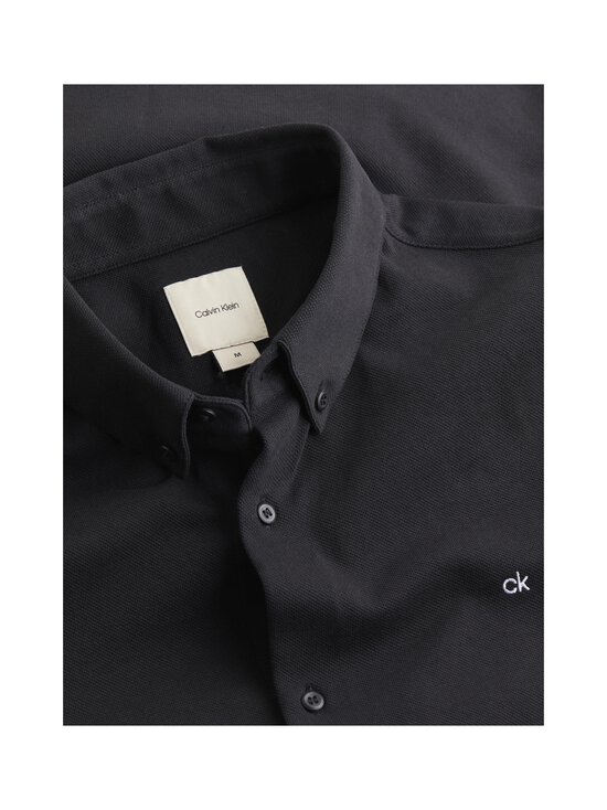 Calvin Klein Menswear - Polo krekls ar garām piedurknēm - BEH CK BLACK - photo 2 Calvin Klein Menswear - Polo krekls ar garām piedurknēm - BEH CK BLACK | Stockmann - photo 2